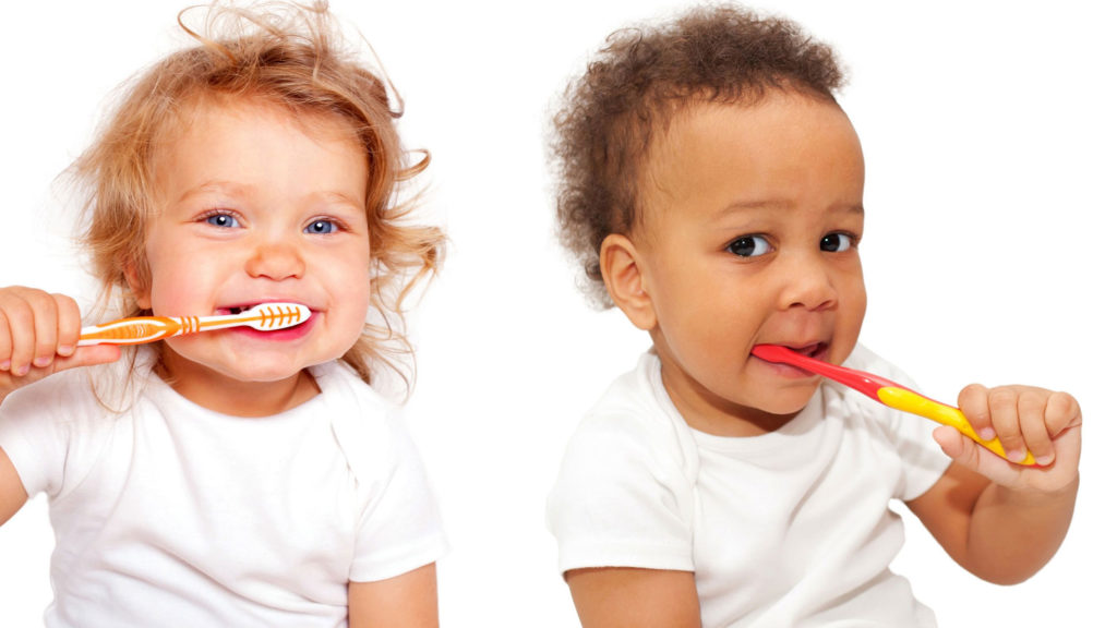 two kids brush their teeth using our pediatric dental experts number 1 recommended tooth brushing technique