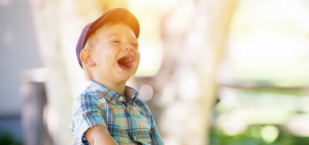 A happy toddler boy learns worst habits for kids dental health
