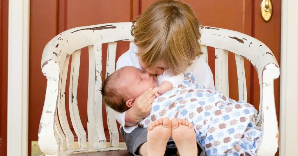 toddler kisses newborn brother and asks mom What to eat after frenectomy